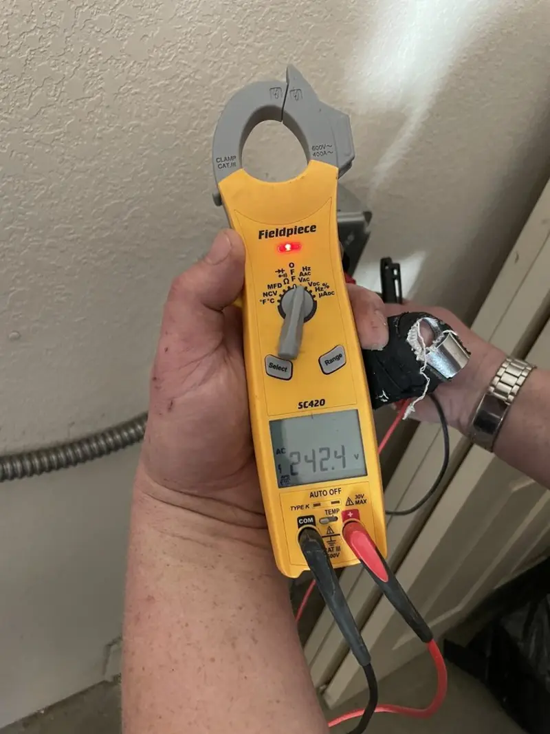 Voltage testing with clamp meter during Electrical Installation Services in Canajoharie